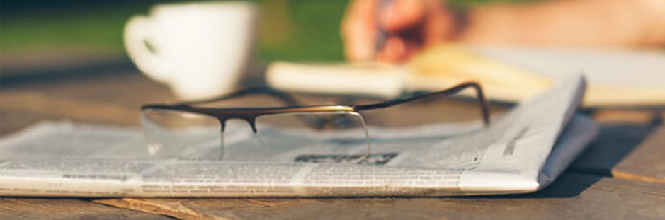 Glasses on a newspaper